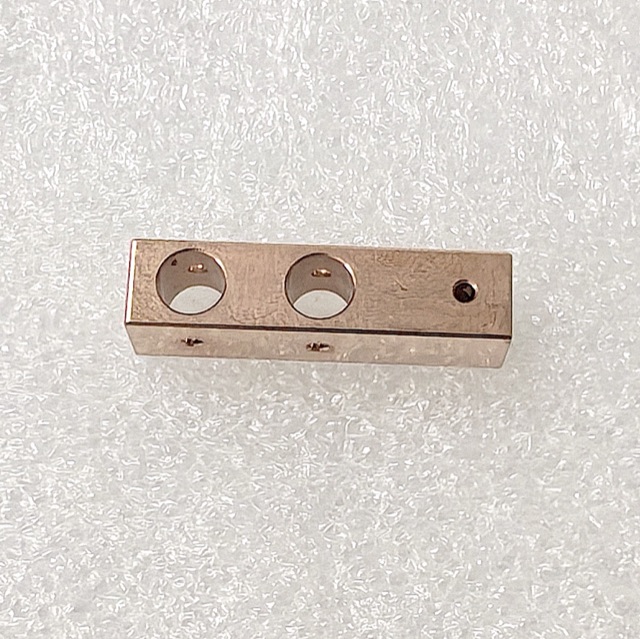Custom copper precision component manufactured by Maisi Precision.
