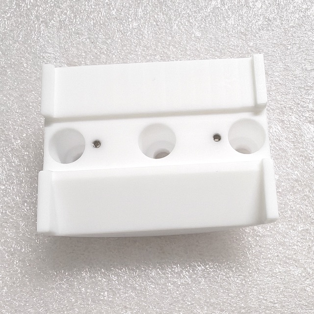 Custom PTFE precision component manufactured by Maisi Precision.