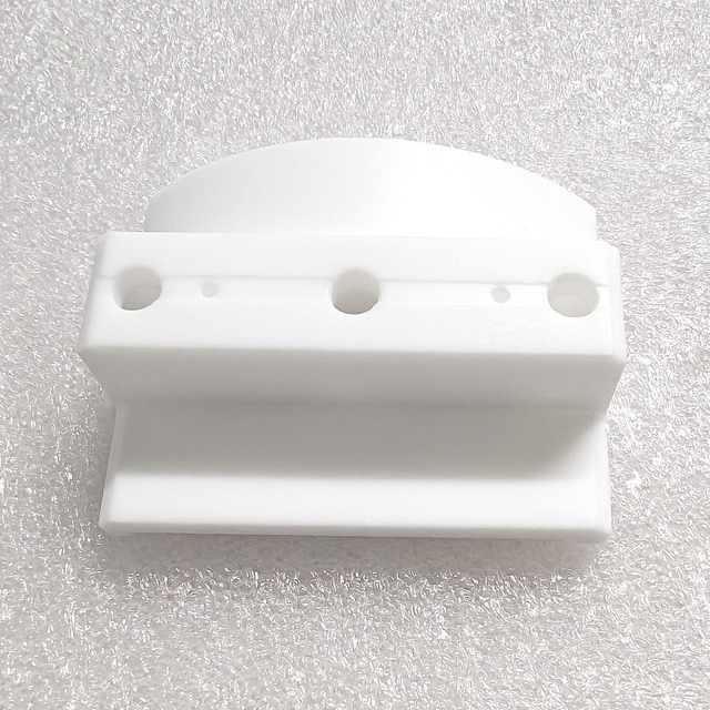 Custom PTFE precision component manufactured by Maisi Precision.